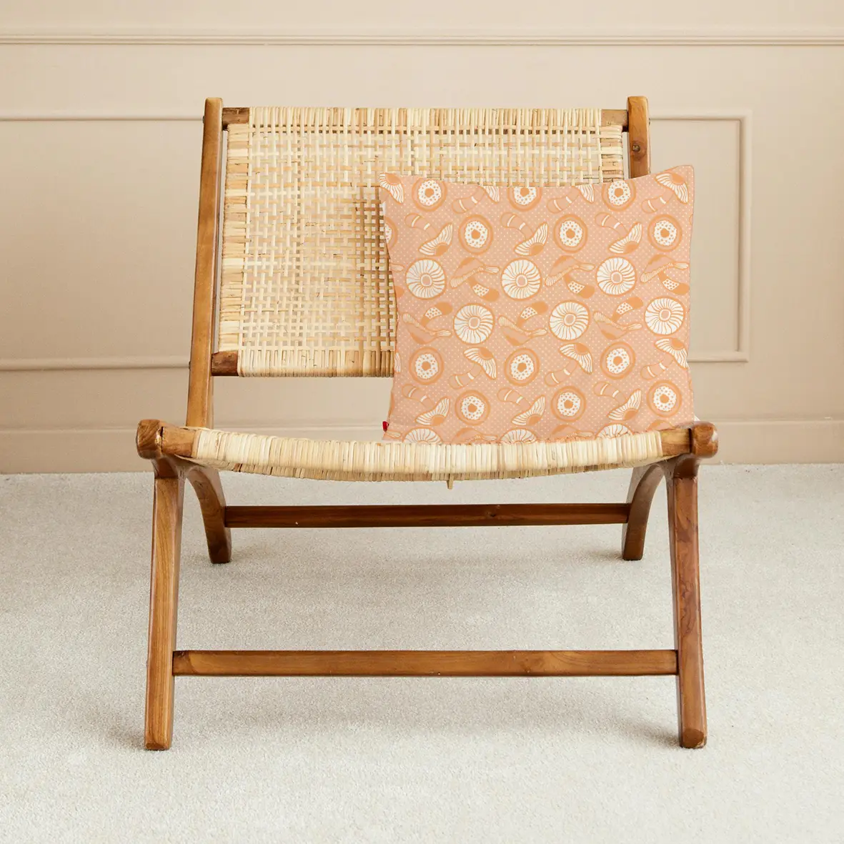 Mushroom Apricot cushion on chair mockup by © Nanjala Design for UndaMeta